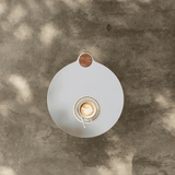 Side Table with Stainless Steel Tabletop and Curved Travertine Base