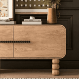 Modern Storage Cabinet with Stacked Legs and Beaded Handles